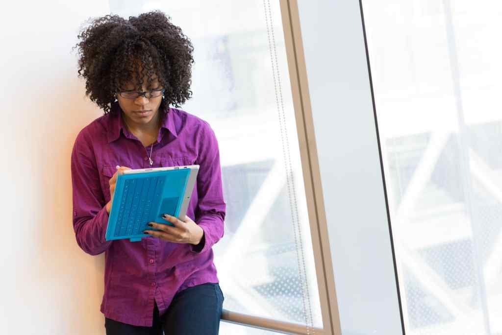 woman focused on work on tablet