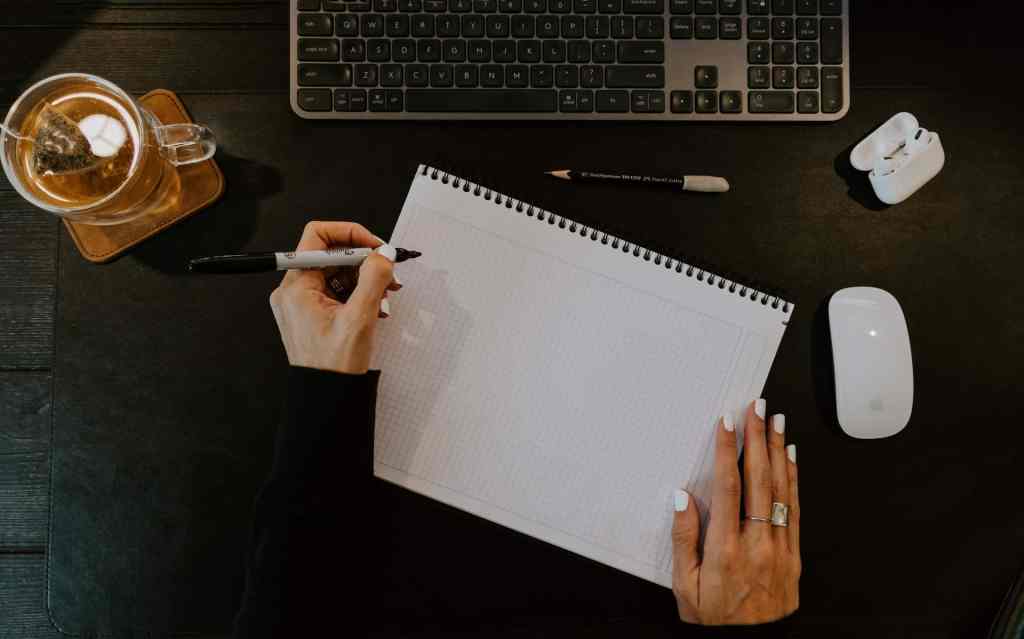 Minimalist desk view from above productive workspace blank notepad