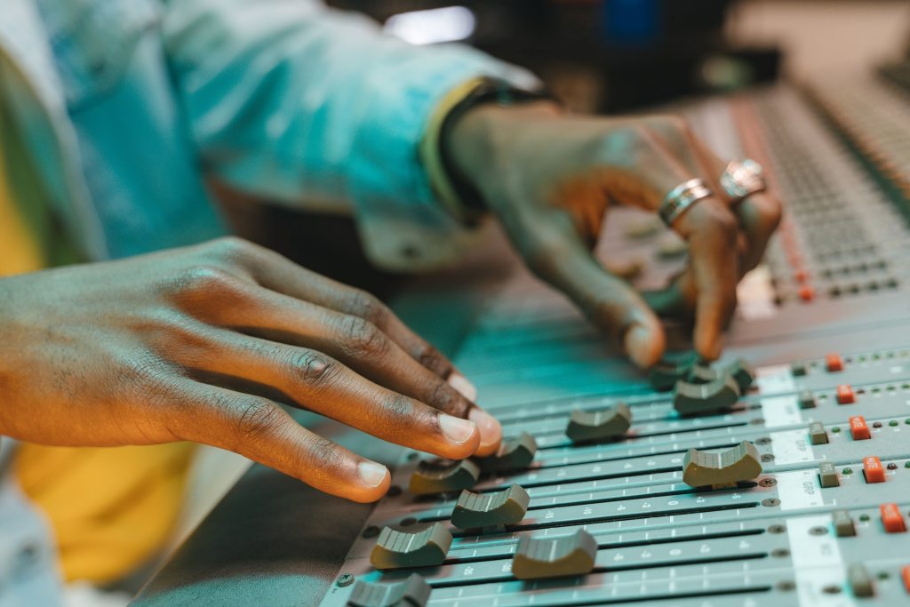musician working at mixing desk, flow state